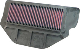 K&N air filter 739200 in a rectangular shape with a foam and metal mesh construction for vehicle air intake enhancement.