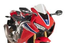 Load image into Gallery viewer, Clear PUIG racing windscreen for motorcycle, aerodynamic windshield with mounting hardware, designed for high-performance riding.
