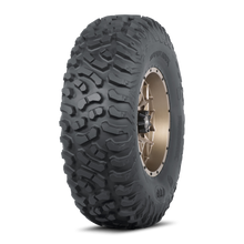 Load image into Gallery viewer, ITP Terra Hook tire 35x10R-15 with rugged tread pattern and durable sidewalls for off-road vehicles.