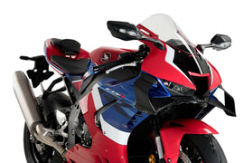 Black PUIG front GP spoiler for motorcycle body, showcasing sleek aerodynamic design and mounting points.