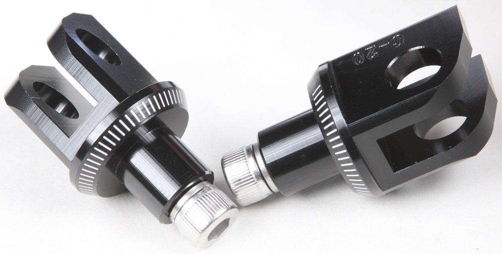Black PUIG Footpeg Adapter 561-06677BK for motorcycle foot controls, shown attached to bike footpeg.