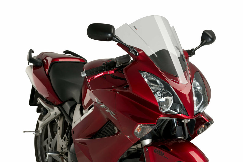 PUIG Racing Smoke Windscreen for motorcycle, featuring tinted, aerodynamic design and mounting brackets visible in the image.