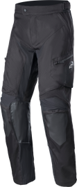 Black Alpine Star Venture Xt over boot pants with reinforced knee panels and adjustable waistband for motorcycle riding comfort.
