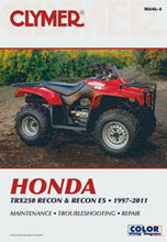 Load image into Gallery viewer, Clymer repair manual for Honda TRX250 Recon ATV, showing detailed pages and diagrams for vehicle maintenance and repair.