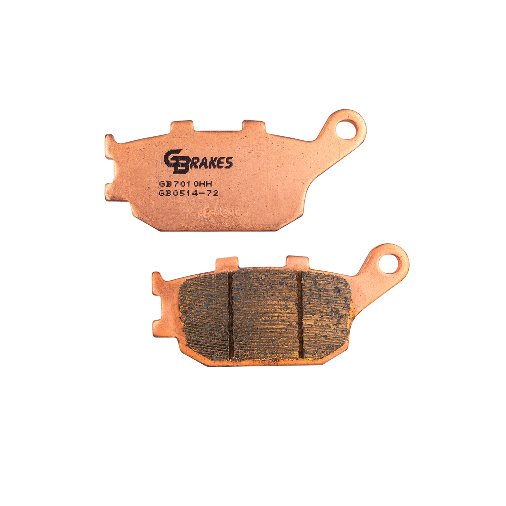 GBRAKES sintered brake pads with visible metal friction surface and mounting holes for automotive braking system.