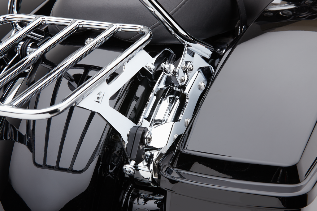Cobra black backrest mounting kit for FLH and FLT motorcycles, showing metal brackets and mounting hardware.