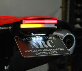 New Rage Cycles Fender Eliminator body for HON motorcycle, shown from a side view with mounting details and sleek design.