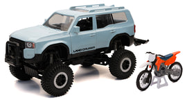Orange race bike and Land Cruiser truck accessories by New Ray Toys, 1:18 scale, detailed vehicle models in the image.