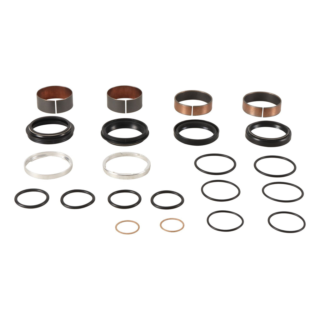 Pivot Works suspension seal and bushing kit for motorcycle forks, with various seals and bushings laid out on a white background.
