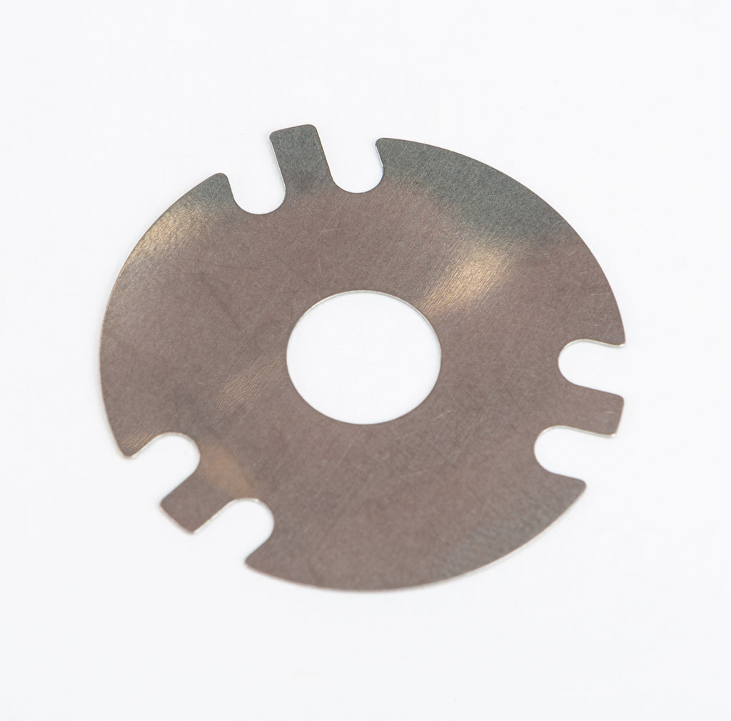 Fox 6 port bleed shim valve for suspension, measuring 1.3"x0.375"x0.008", in metallic finish, designed for Fox shock systems.