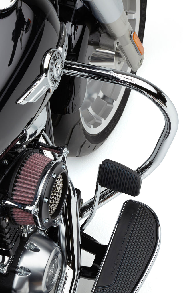 Chrome Cobra Freeway Bars 1.25-inch for Harley FLSTC models 2000-2017, mounted on motorcycle body, shiny and sleek.