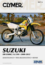 Load image into Gallery viewer, Clymer repair manual for Suzuki DRZ400E, S, and SM motorcycles, showing detailed pages and diagrams for motorcycle maintenance.