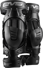 EVS Axis Sport knee brace pair in black and grey, medium size, designed for support and protection during sports activities.