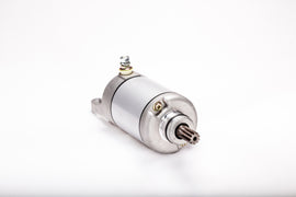 Ricks Motorsport Electric starter motor for Kawasaki models, showing the compact, durable electric starter with wiring components.