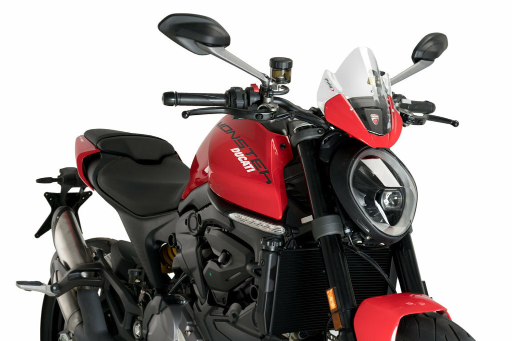 PUIG clear sport windshield for Ducati motorcycle, OEM flyscreen style, showing the transparent, curved windscreen mounted on bike.