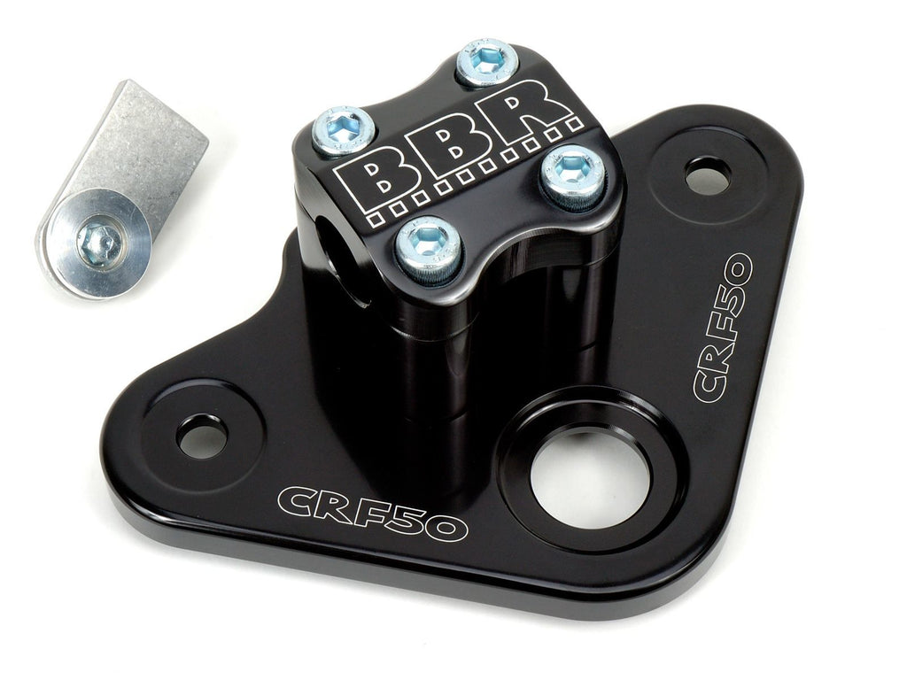 Black bbr triple clamp for motorcycle, featuring a sturdy design with visible mounting holes and a matte finish.