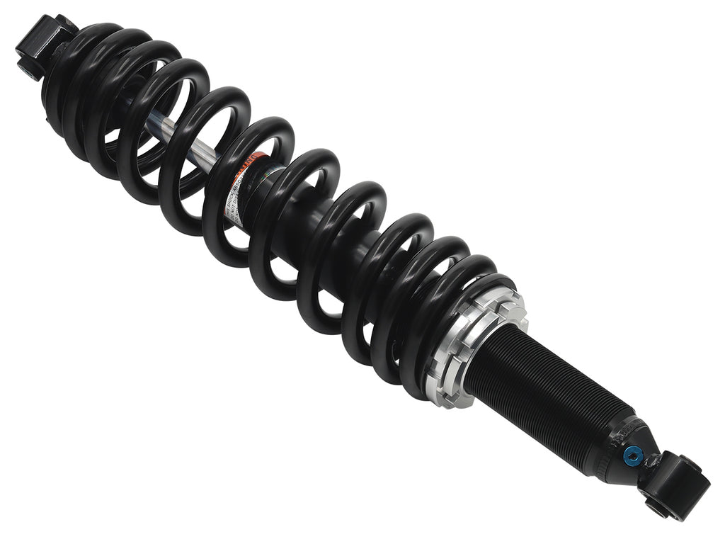 Bronco rear gas shock absorber with model number 183-04471, showing a close-up of the shock's metal cylinder and mounting ends.