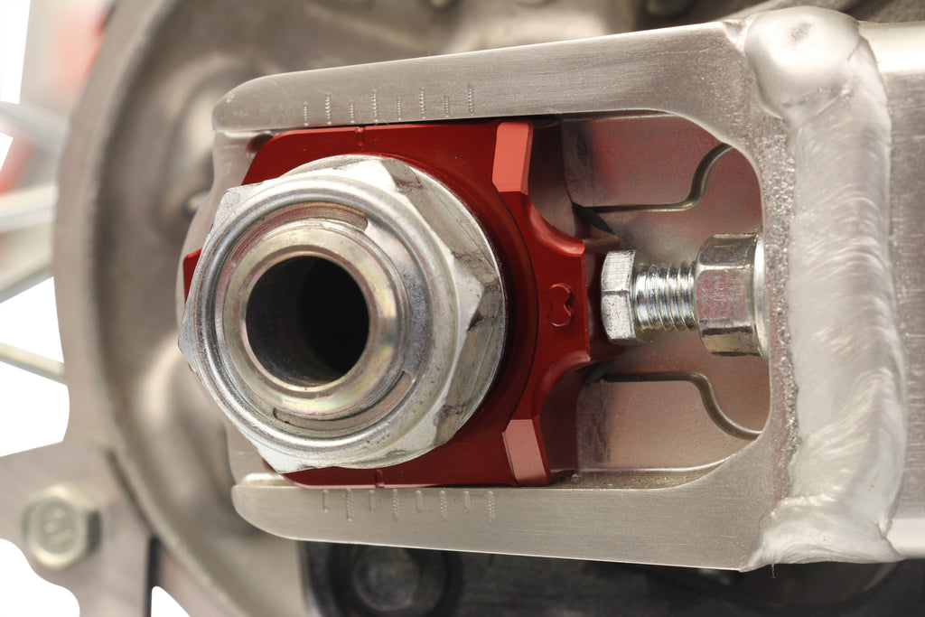 WORKS Axle Blocks Elite Hon Red drive axle blocks, featuring vibrant red color and durable construction for vehicle stability.