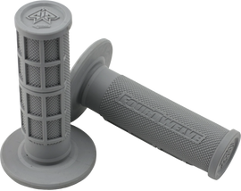 Grey Pee Wee / Pit Bike Mini Grips 7/8 inch by FOUR TWELVE, shown on a motorcycle handlebar.