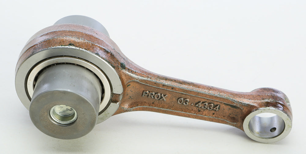 ProX Racing Parts connecting rod kit for Kawasaki and Suzuki engines, showing metal rods and components in a close-up image.