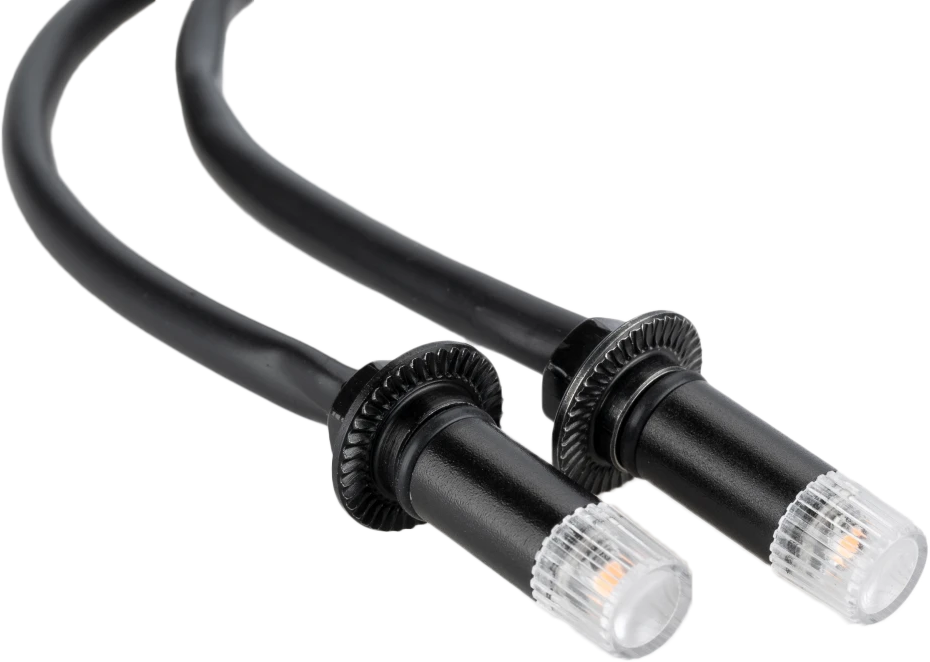 PUIG black tab turn signals with clear lenses for motorcycles, featuring compact design and durable housing.