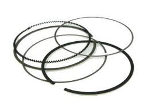 Close-up of 52.44mm Kaw/Suz piston rings for NAMURA piston kits, showing the shiny metal rings with detailed grooves.