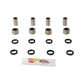 Pivot Works suspension linkage rebuild kit 52-0212 with various metal components and bushings for motorcycle suspension maintenance.
