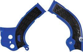 Acerbis X-Grip frame guard in blue and black on motorcycle frame, providing protection and style for off-road bikes.