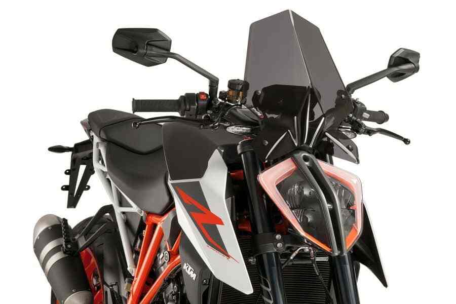 PUIG Naked New Gen Sport dark smoke windshield for motorcycle, featuring a sleek, tinted windscreen with aerodynamic design.
