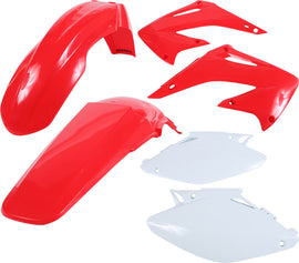 Acerbis red plastic kit for motorcycle, including various plastic panels and parts, displayed on a flat surface.
