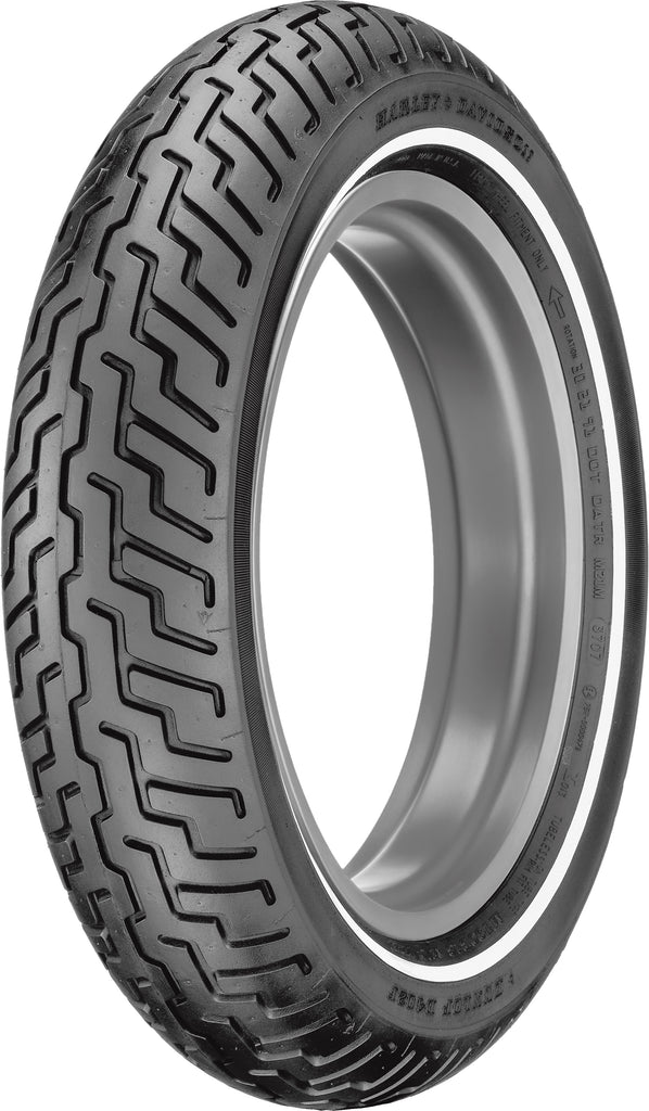 Dunlop D402 front motorcycle tire mounted on wheel, showing tread pattern and sidewall design in a close-up shot.