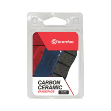 Load image into Gallery viewer, Brembo Prime CC brake pads made of carbon ceramic with metallic backing, featuring detailed surface and cooling vents.