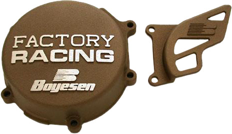 Boyesen Factory Racing Magnesium Ignition Cover for motorcycles, showing the sleek metallic finish and detailed branding on the cover.
