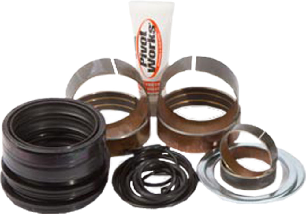 Pivot Works suspension seal and bushing kit for forks, showing various seals and bushings organized on a white background.