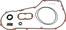 Load image into Gallery viewer, James Gasket primary cover gasket kit for Dyna Softail 5-speed bikes, includes paper seals and replacement components.
