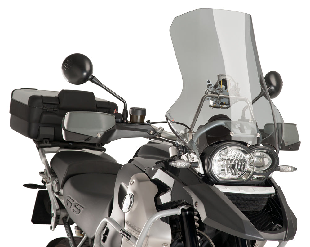 PUIG touring smoke windscreen for motorcycle, clear windshield with dark tinted smoke finish, designed for aerodynamic protection.