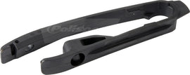 Black Polisport Plastics 2-stroke drive chain slider for motorcycles, part number 64-0304, shown installed on a bike.