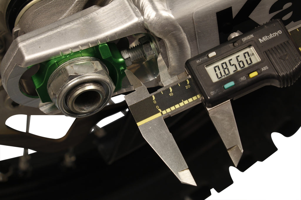 WORKS Axle Blocks Elite Kaw/Suz Green drive accessory, featuring vibrant green color and precise fit for motorcycle axles.