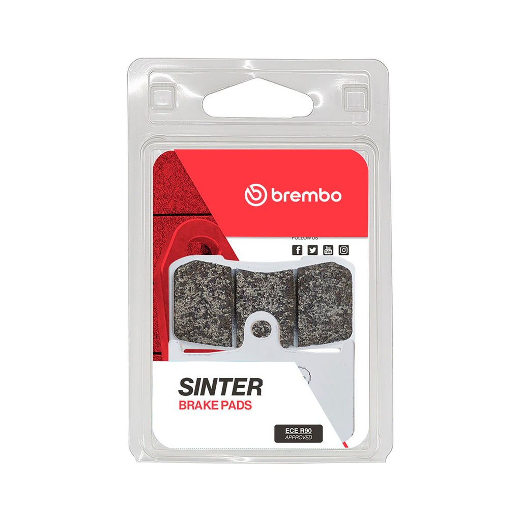 Brembo Prime La semi-sintered brake pads with Brembo branding, showing the brake pad surface and mounting hardware.