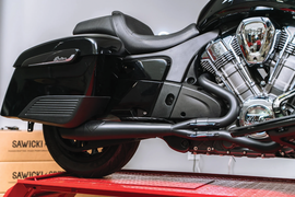 Sawicki Speed Shop Indian Challenger mid-length Cannon Black exhaust system installed on motorcycle, showing sleek black finish.