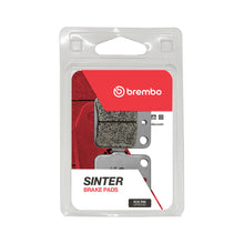 Load image into Gallery viewer, Brembo Sx brake pads, sintered upgrade for enhanced braking performance, shown in a close-up image of the brake components.