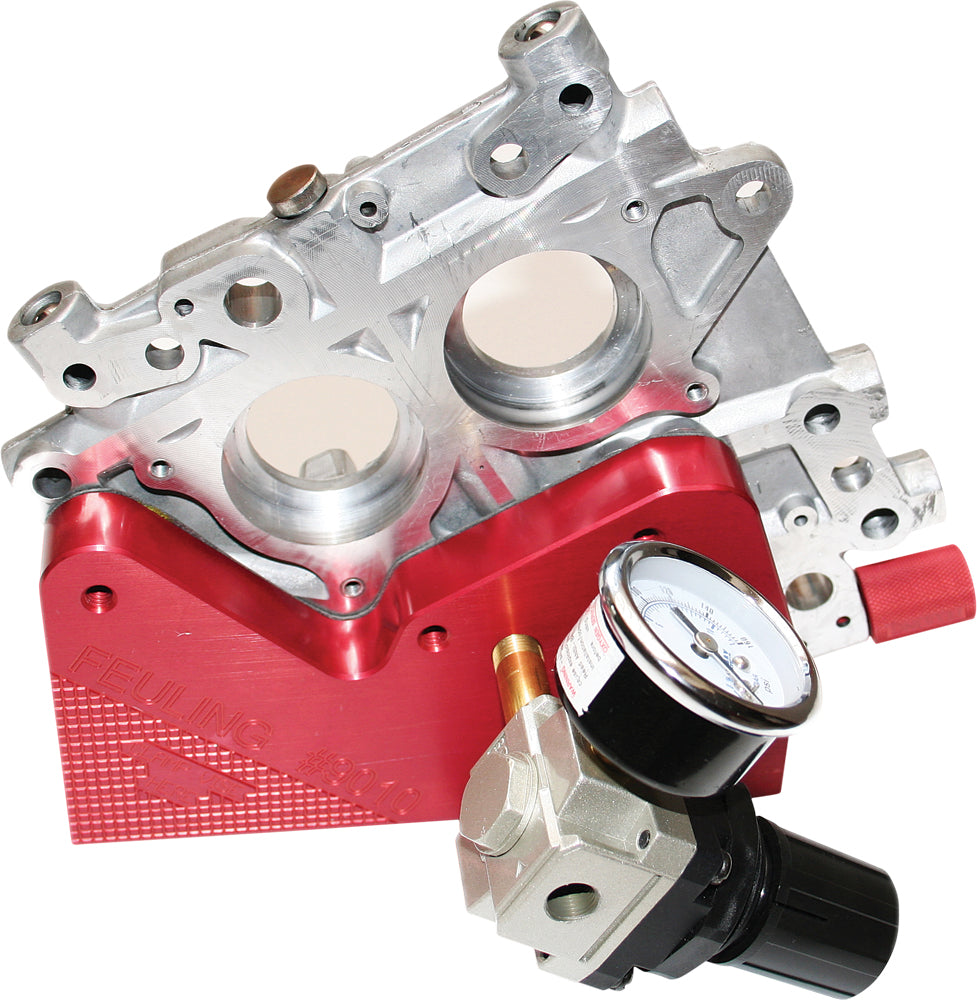 Feuling Camplate Psi Tester tool for engine camshaft testing, featuring a compact metal design with measurement gauges.