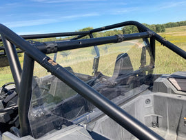 Polaris RZR with Kolpin Poly Rear Windshield installed, showing the durable, clear poly material on the back of the vehicle.