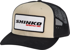 Shinko black and natural snapback hat with a flat brim and adjustable strap, featuring bold branding on the front.