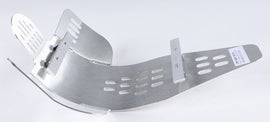 Devol Skid Plate 60-7009, black metal undercarriage protector for off-road vehicles, shown installed on a vehicle's underside