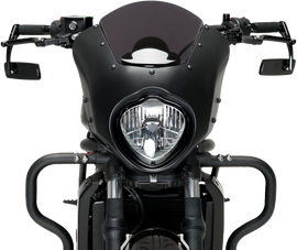 Black PUIG rearview mirror with sleek design, mounted on a motorcycle handlebar, showcasing its reflective glass and mounting arm.