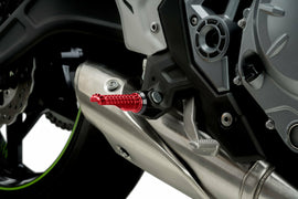 PUIG R-Fighter Red footpegs for motorcycle foot controls, featuring durable design and vibrant red color.