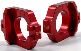 WORKS Axle Blocks Elite Kaw/Suz Red drive accessories for motorcycle axle stabilization, shown in red color.