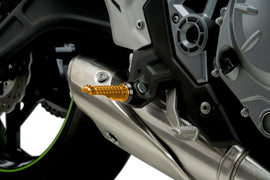 PUIG R-Fighter Gold footpegs for motorcycle foot controls, featuring a sleek gold finish and durable metal construction.