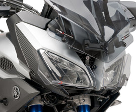 PUIG Headlight Protector body for motorcycle, clear plastic shield designed to protect headlights from debris and damage.